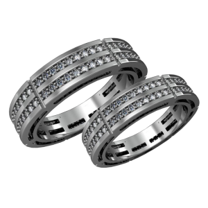 A pair of gold wedding bands with diamonds