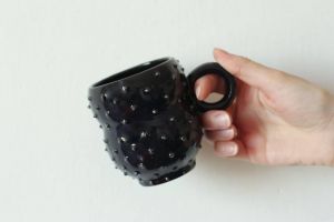Black symmetrical ceramic mug