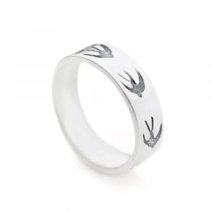 Silver ring band with tiny swallows