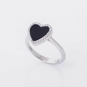 Silver ring with black heart