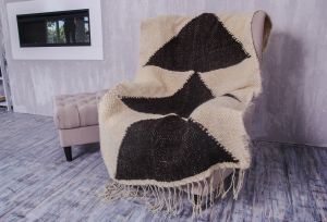 White wool throw with black triangles