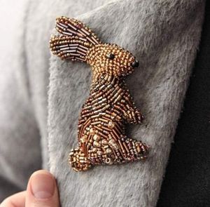Beaded brooch "Golden Bunny"