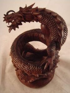 Dragon artisan crafted wood sculpture