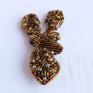Gold beaded brooch "Royal deer"