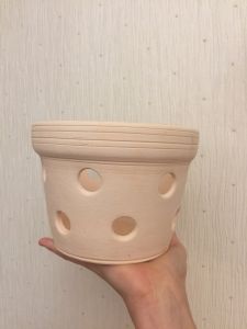 White unglazed orchid pots with holes
