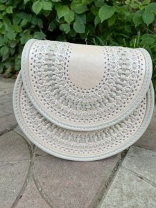 White round hand tooled leather purse