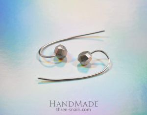 Long stud earrings with silver beads