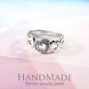 Luxury jewelry. Silver ring "Crystal Hearts"